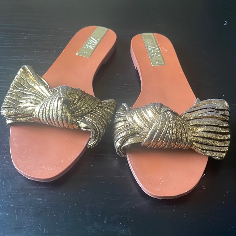 Gold cross tie sandals